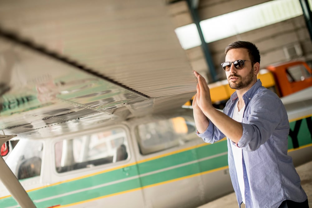 Pilot performing preflight check